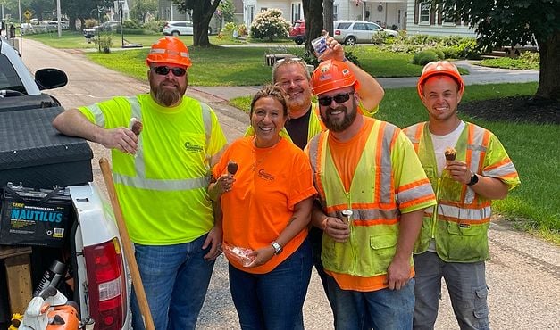 employees wearing safety gear at an ice cream truck