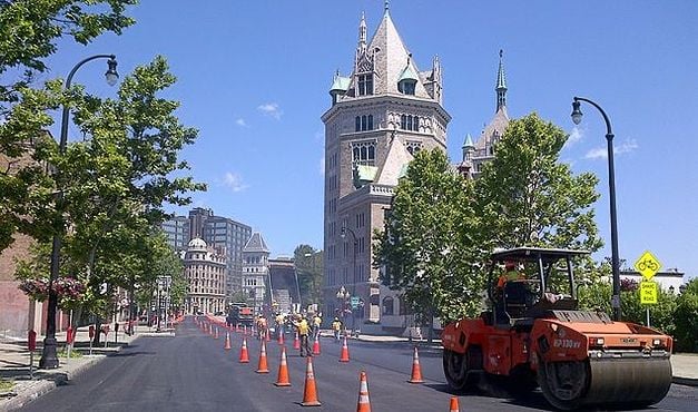 steamroller in front of tower