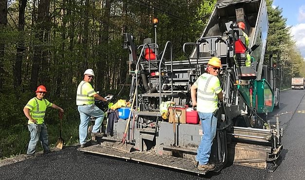 employees paving road